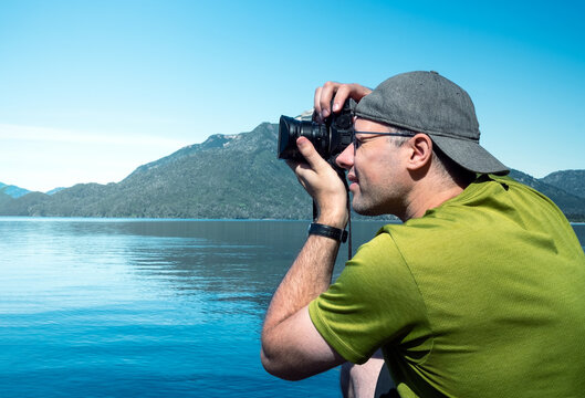 Photographer taking a photo in nature. Photography class learning. Course lesson practice teaching.