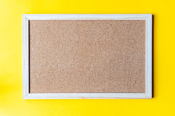 A cork board is a framed section of cork backed with wood or plastic. Typically, it is used as a bulletin board, because the resilient nature of cork makes it ideal for sticking pins and tacks into.