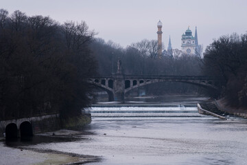 Munich, Germany - December 19 2021: Bridge on the Isar river on winter day.