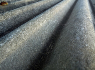 old asbestos texture. shabby surface with moss and dirty stains. grooved and wavy texture