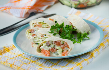 Salmon, avocado and cream cheese roll in lavash