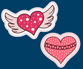 Two stickers of a heart. With wings and decor