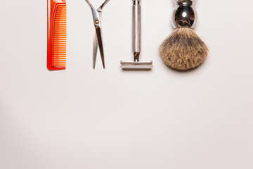 barber tools for shaving and haircuts on a white background, copy space