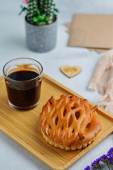 Breakfast for your beloved on a tray. Pomegranate juice with a slice of apple pie and flowers. A bright, romantic photo of the early morning.