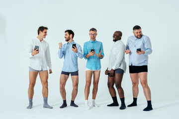 multiethnic men posing for a male edition body positive beauty set.  guys with different age, and...