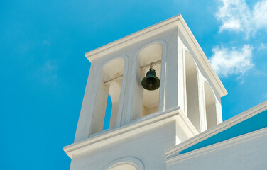 Church bells on blue sky background