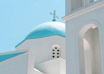 Church cross on top of roof on blue sky background