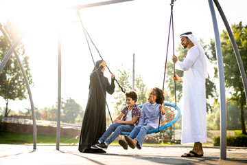 Cinematic image of a family playing at the playground