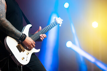 Fototapeta na wymiar Guitarist performing at a live concert.