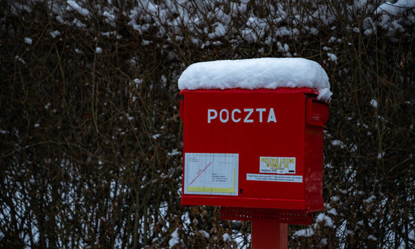 Kraków, Poland - January 22, 2022: A picture of a red Polish post box.