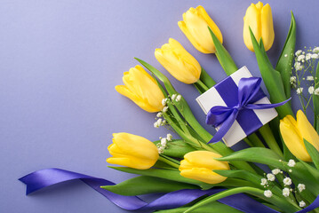 Top view photo of woman's day composition bouquet of yellow tulips and white gypsophila white giftbox with purple bow and violet ribbon on isolated pastel lilac background with copyspace