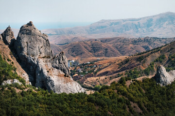 Sunset over the valley among the mountains. Vineyards in autumn in the Crimea. Sun Valley, Crimea....