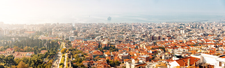 Fototapeta na wymiar Panoramic view of the city of Thessaloniki and the sea from the observation deck in the upper town of Ano Poli. Real Estate and urban development in Greece