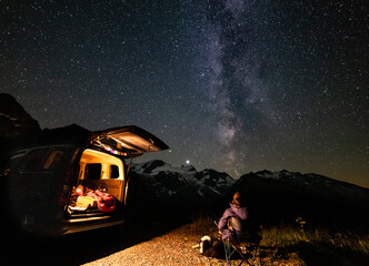 night camping with dog in my van under the Milky Way in the Swiss alps Sustenpass 