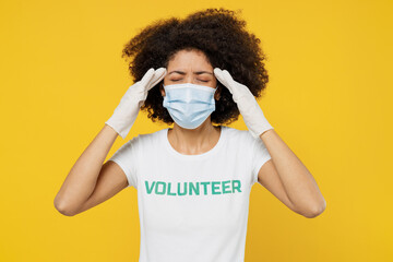 Young woman of African American ethnicity wear white volunteer t-shirt sterile mask ppe from...
