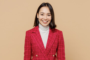 Smiling happy cheerful satisfied fun cool trendy woman of Asian ethnicity wear red jacket look...