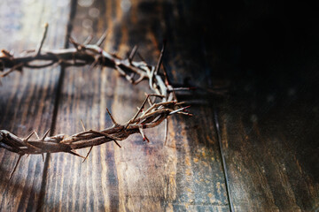 Christian crown of thorns like Christ wore with blood drops over a rustic wood background or table....