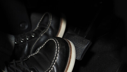 Accelerate and Brake. Foot pressing foot pedal of a car to drive ahead. Accelerator and brake pedal...