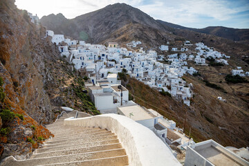 Serifos island Chora town white building on rocky land and stone stair. Cyclades Greece. - obrazy, fototapety, plakaty