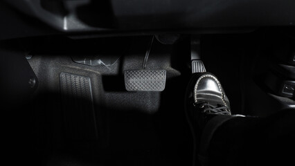 Accelerate and Brake. Foot pressing foot pedal of a car to drive ahead. Accelerator and brake pedal...