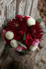 Wedding bouquet . The bride's bouquet. Bouquet of red flowers. Bridal douquet composed of dahlia and roses.