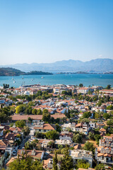 Fototapeta premium Fethiye landscape and cityscape, aerial view of the popular resort city of Fethiye and the Bay of the Mediterranean sea, Turkey.