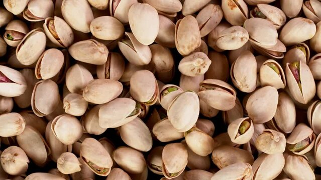 Super Slow Motion Shot of Moving Pistachio Nuts. Filmed on High Speed Cinematic camera at 1000 fps.