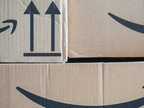Marbella, Spain - January 21, 2022: Amazon boxes stacked with copy space. Amazon is the largest online retailer in the Unites States