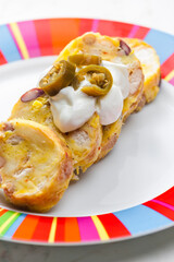 bean dumplings with sour cream and jalapenos
