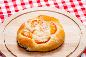 apricot pie on wooden board