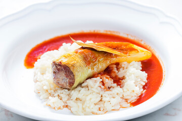pepper stuffed with minced meat served with tomato sauce and rice