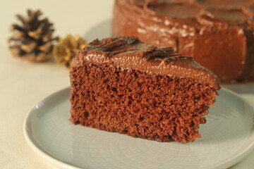 Chocolate cake slice, with chocolate butter cream icing.