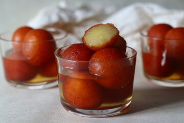 Gulab jamun . A milk solid based sweet popular in Indian subcontinent