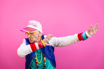 Funny grandmother portraits. 80s style outfit. Dab dance on colored backgrounds. Concept about...