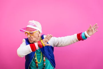 Muurstickers Funny grandmother portraits. 80s style outfit. Dab dance on colored backgrounds. Concept about seniority and old people © oneinchpunch