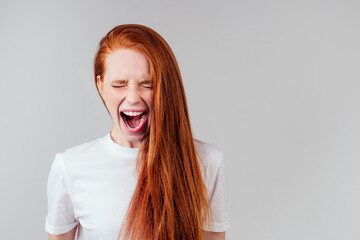 redhaired ginger student woman with open mouth and bad teeth