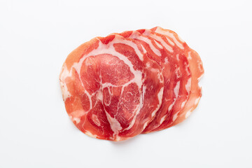 Italian prosciutto crudo or jamon. Raw ham. Isolated on white background.