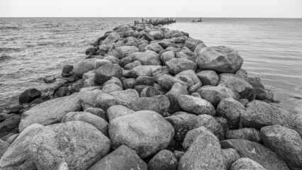 an old pier made of stones and wood