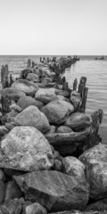 an old pier made of stones and wood