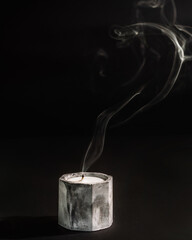 candle with the smoke on the black background