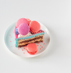 piece of cake with pink and blue decor on white plate