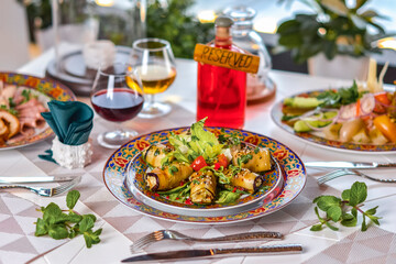 Georgian cuisine dishes: pickles and stuffed eggplant.