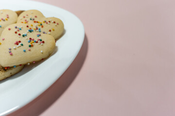 Bake Valentine's Day heart shaped cookies. Recipe. Beautiful shortbread close-up, Place for text, copy space