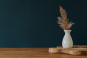 Turquoise wall and grass decoration in vase