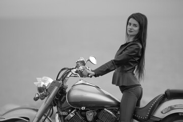 Portrait of young woman on motorcycle