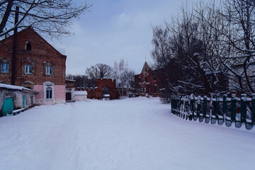 The snow-swept courtyard of an ancient noble manor