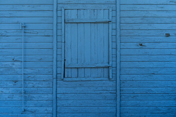 blue wooden window with shutters