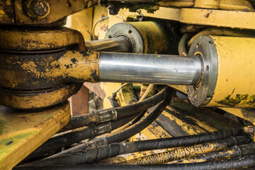 hydraulic pistons of an old excavator machine