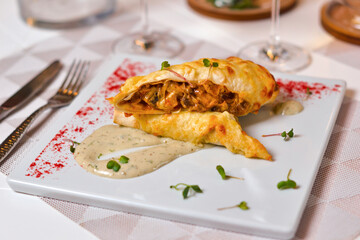 Dishes of Eastern cuisine: meat and mushrooms in soy dough.