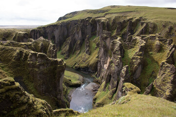 Green Grassy mountain Landscape in the highlands. Travel and nature on a beautiful cold day